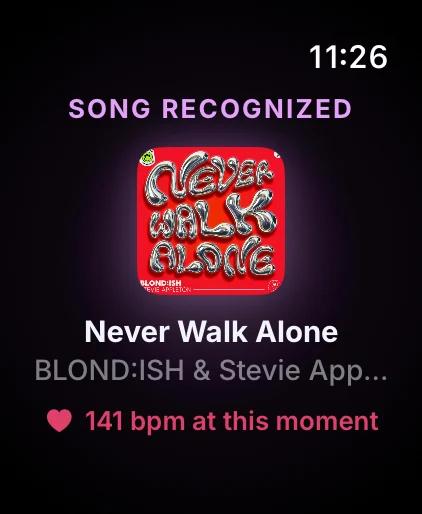 Watch showing a recognized song and the heart rate at that moment
