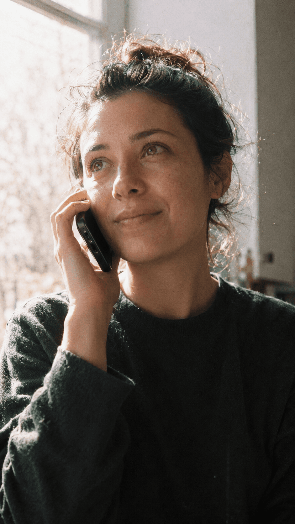 A woman smiling during a call
